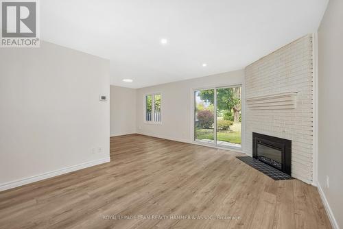 8 Chisholm Court, Ottawa, ON - Indoor Photo Showing Living Room With Fireplace