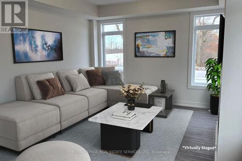 4 - 6894 Garner Road, Niagara Falls, ON - Indoor Photo Showing Living Room