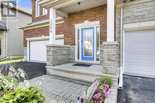 Interlock front walkway & dbl attached Garage. - 1024 Northgraves Crescent, Ottawa, ON - Outdoor With Exterior