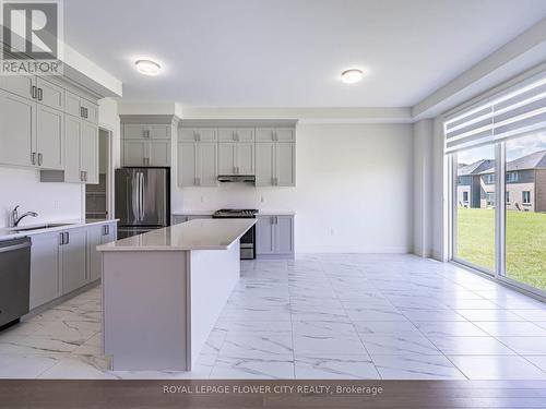 26 Hummingbird Grove, Adjala-Tosorontio, ON - Indoor Photo Showing Kitchen With Upgraded Kitchen