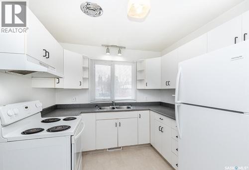 1312 13Th Street E, Saskatoon, SK - Indoor Photo Showing Kitchen With Double Sink