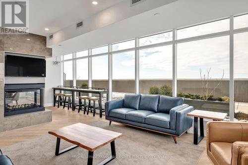 502 - 195 Hunter Street E, Peterborough (Ashburnham Ward 4), ON - Indoor Photo Showing Living Room With Fireplace