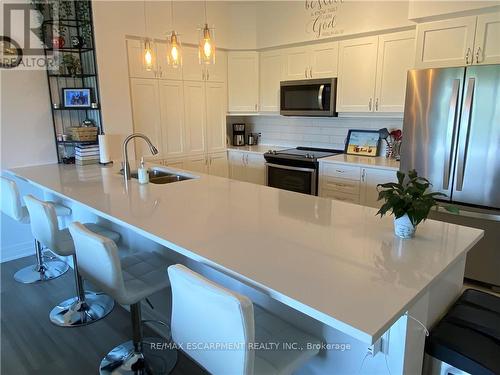 312 - 39 Sister Varga Terrace, Hamilton, ON - Indoor Photo Showing Kitchen With Double Sink With Upgraded Kitchen