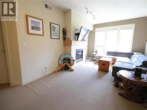 7343 Okanagan Landing Road Unit# 2204, Vernon, BC - Indoor Photo Showing Other Room With Fireplace
