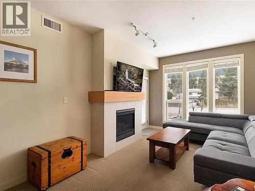 7343 Okanagan Landing Road Unit# 2204, Vernon, BC - Indoor Photo Showing Living Room With Fireplace