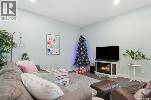 220 105 Willis Crescent, Saskatoon, SK - Indoor Photo Showing Living Room With Fireplace