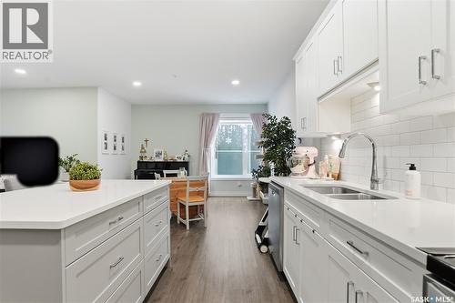 220 105 Willis Crescent, Saskatoon, SK - Indoor Photo Showing Kitchen With Double Sink
