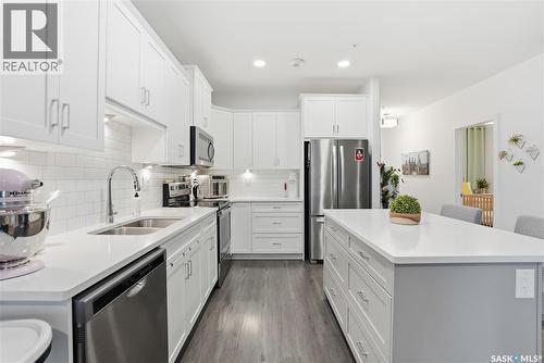 220 105 Willis Crescent, Saskatoon, SK - Indoor Photo Showing Kitchen With Stainless Steel Kitchen With Double Sink With Upgraded Kitchen