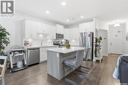 220 105 Willis Crescent, Saskatoon, SK - Indoor Photo Showing Kitchen With Stainless Steel Kitchen With Upgraded Kitchen
