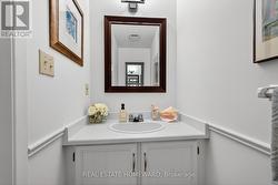MAIN FLOOR POWDER ROOM - 