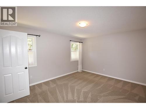 Primary bedroom - 312 Grouse Avenue, Vernon, BC - Indoor Photo Showing Other Room