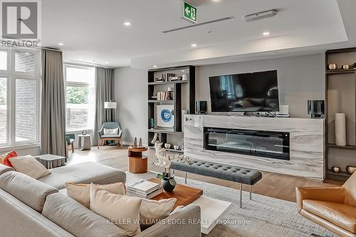 302 - 457 Plains Road E, Burlington, ON - Indoor Photo Showing Living Room With Fireplace
