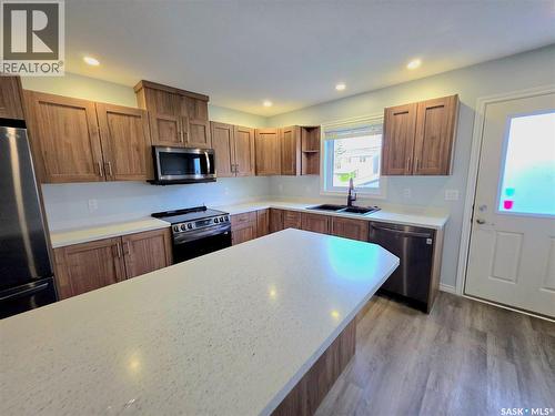 720 O Avenue S, Saskatoon, SK - Indoor Photo Showing Kitchen With Double Sink