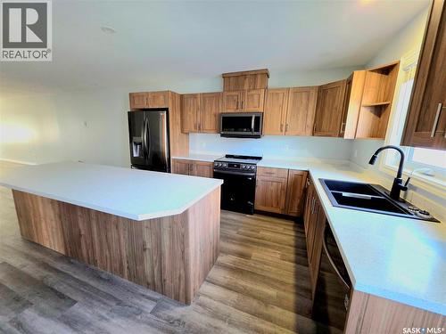 720 O Avenue S, Saskatoon, SK - Indoor Photo Showing Kitchen With Double Sink