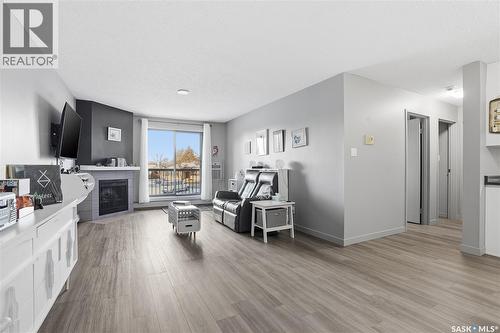 202 802B Kingsmere Boulevard, Saskatoon, SK - Indoor Photo Showing Living Room With Fireplace