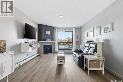 202 802B Kingsmere Boulevard, Saskatoon, SK - Indoor Photo Showing Living Room With Fireplace