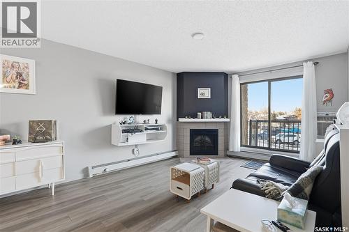 202 802B Kingsmere Boulevard, Saskatoon, SK - Indoor Photo Showing Living Room With Fireplace