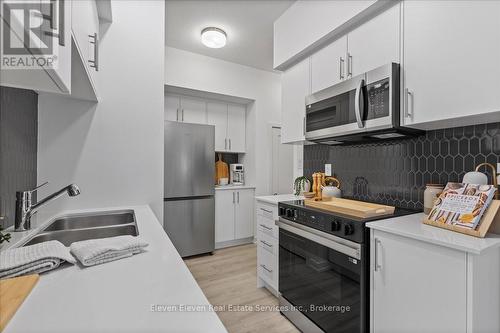 91 - 940 St. Davids Street, Centre Wellington, ON - Indoor Photo Showing Kitchen With Stainless Steel Kitchen With Double Sink