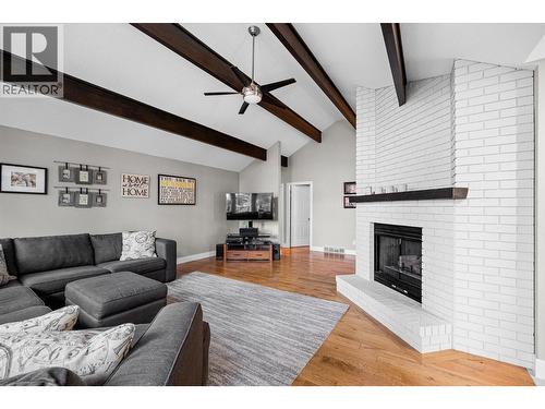 3885 Miller Road, Kelowna, BC - Indoor Photo Showing Living Room With Fireplace