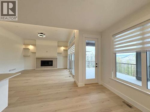 2140 Montenegro Drive, Kelowna, BC - Indoor Photo Showing Other Room With Fireplace