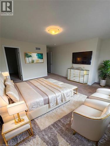 Carpeted bedroom featuring baseboards - 4 Riddell Drive, Stratford, ON - Indoor Photo Showing Bedroom