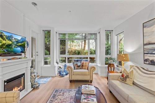 104-5670 Edgewater Lane, Nanaimo, BC - Indoor Photo Showing Living Room With Fireplace