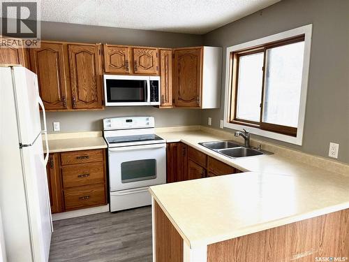 354 Allegretto Crescent, Saskatoon, SK - Indoor Photo Showing Kitchen With Double Sink