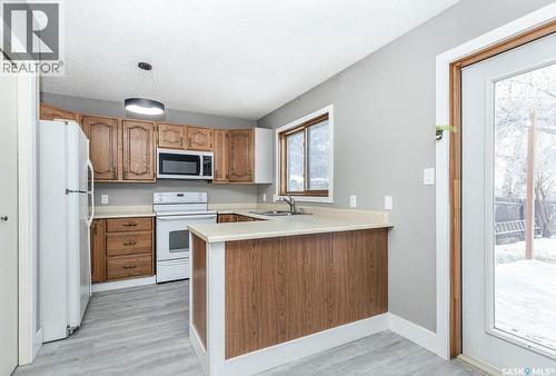 354 Allegretto Crescent, Saskatoon, SK - Indoor Photo Showing Kitchen With Double Sink
