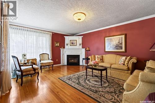 3102 Assiniboine Avenue, Regina, SK - Indoor Photo Showing Living Room With Fireplace