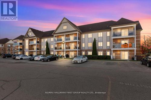 204 - 132 Aspen Springs Drive, Clarington (Bowmanville), ON - Outdoor With Balcony With Facade
