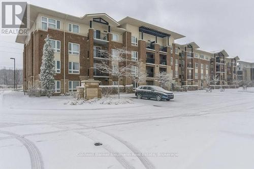 406 - 45 Kingsbury Square, Guelph (Pineridge/Westminster Woods), ON - Outdoor With Balcony With Facade