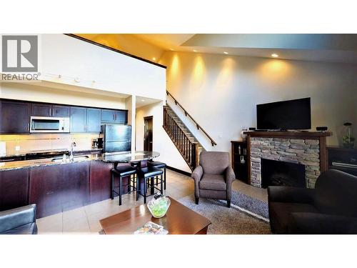 700 Bighorn Boulevard Unit# 735 M1, Radium Hot Springs, BC - Indoor Photo Showing Other Room With Fireplace