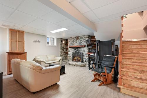 Salle familiale - 1924 94E Avenue, Saint-Blaise-Sur-Richelieu, QC - Indoor Photo Showing Basement With Fireplace