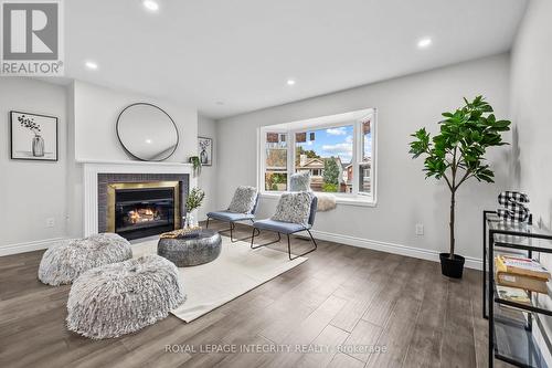 2nd level living room - 83 Saddle Crescent, Ottawa, ON - Indoor With Fireplace