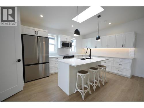 Expanded and upgraded kitchen with skylight - 8900 Jim Bailey Road Unit# 126, Kelowna, BC 