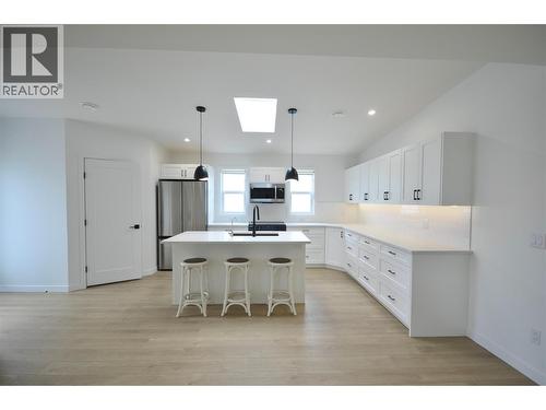 Expanded and upgraded kitchen with skylight - 8900 Jim Bailey Road Unit# 126, Kelowna, BC 