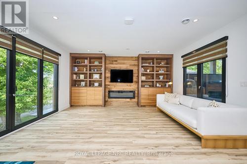 Custom shelving and electric fireplace - 10 Pawling Street, St. Catharines (Port Dalhousie), ON - Indoor With Fireplace