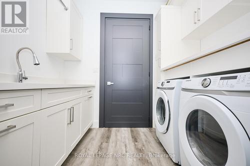 Bedroom level laundry with custom storage - 10 Pawling Street, St. Catharines (Port Dalhousie), ON - Indoor Photo Showing Laundry Room