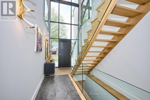 Open riser staircase with glass balustrade - 10 Pawling Street, St. Catharines (Port Dalhousie), ON - Indoor Photo Showing Other Room