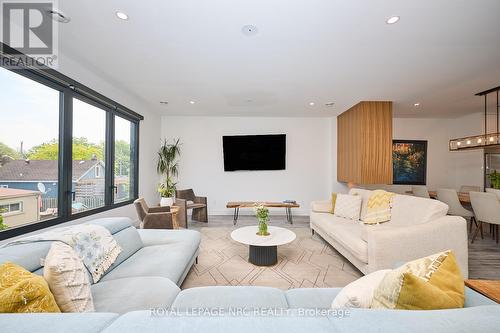 Inviting space feat. a stunning 3-sided fireplace - 10 Pawling Street, St. Catharines (Port Dalhousie), ON - Indoor Photo Showing Living Room