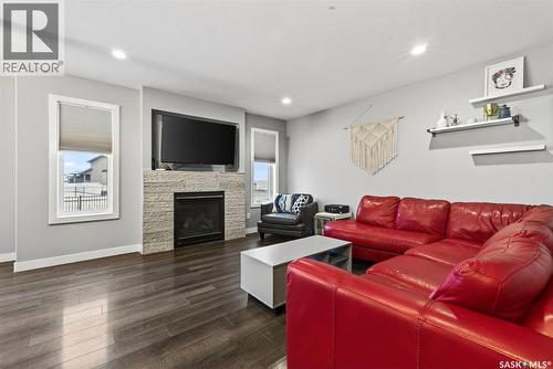 5669 Glide Crescent, Regina, SK - Indoor Photo Showing Living Room With Fireplace