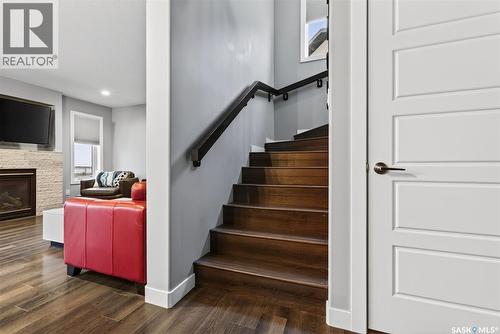5669 Glide Crescent, Regina, SK - Indoor Photo Showing Other Room With Fireplace
