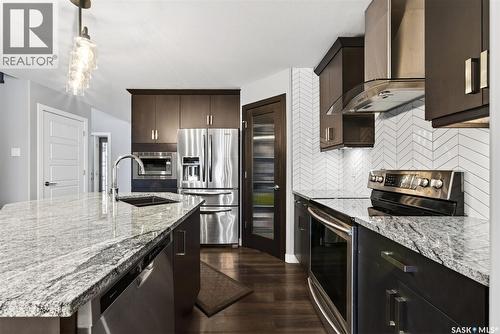 5669 Glide Crescent, Regina, SK - Indoor Photo Showing Kitchen With Double Sink With Upgraded Kitchen