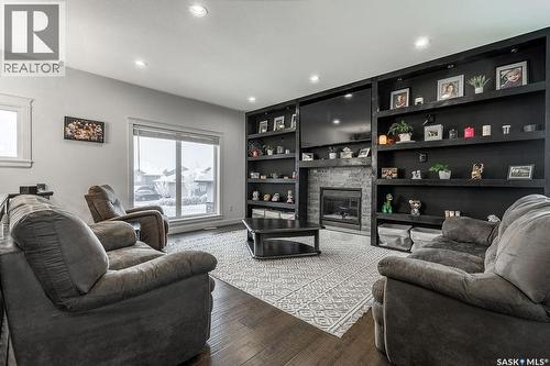 712 Maple Court, Warman, SK - Indoor Photo Showing Living Room With Fireplace