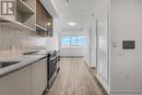 628 - 395 Dundas Street W, Oakville, ON  - Indoor Photo Showing Kitchen 