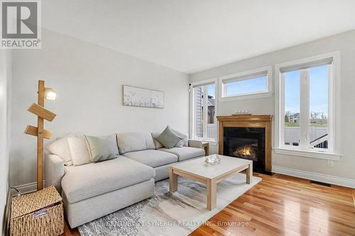 13 - 6834 Breanna Cardill Street, Ottawa, ON - Indoor Photo Showing Living Room With Fireplace