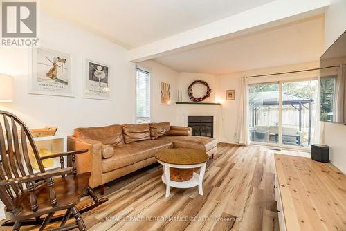 Livingroom with walk-out to yard - 78 Bujold Court, Ottawa, ON - Indoor Photo Showing Living Room With Fireplace