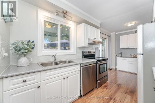 110 - 371 Bronte Street S, Milton, ON - Indoor Photo Showing Kitchen With Stainless Steel Kitchen With Double Sink