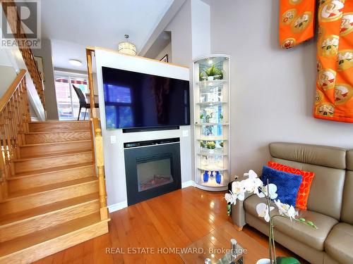 Glass cabinet w/ remote dimmer - 257 Milan Street, Toronto, ON - Indoor Photo Showing Living Room With Fireplace