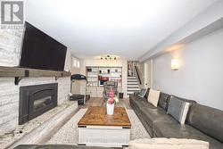 Lower Media Room with Gas Fireplace - 